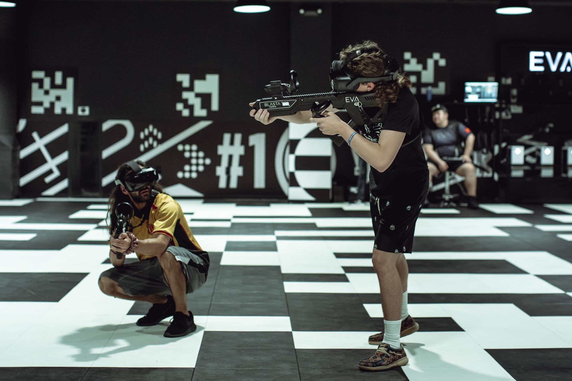 EVA VR in action, left man crouched down and right man looking around